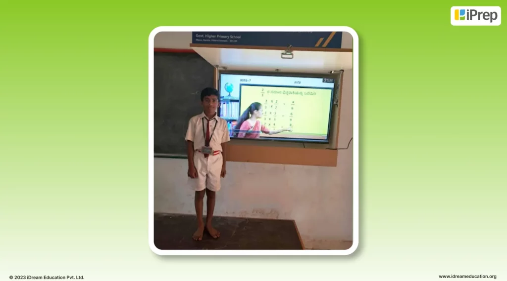 An image of Vikas Kamalakar Pattagar a 7th grade student currently learning in rural Karnataka as he appreciates our smart class solution, the iPrep Digital Class