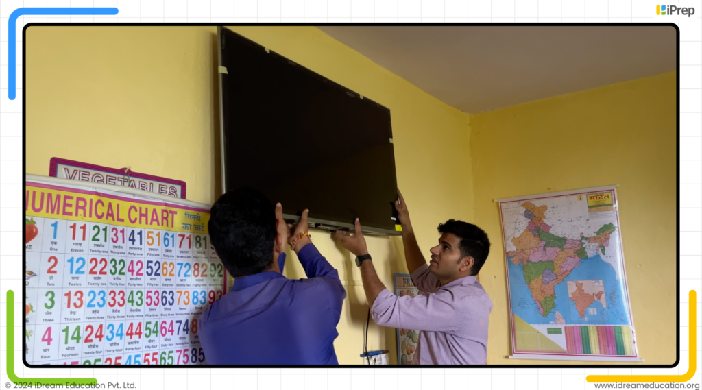 Image showing team members of iDream Education mounting their easy to setup manage and use smart class in government schools