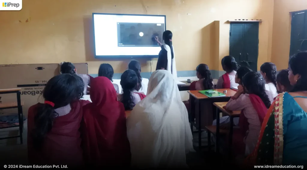 Image depicting a teacher training by iDream Education to use an Interactive Flat Panel (IFP) for smart class teaching