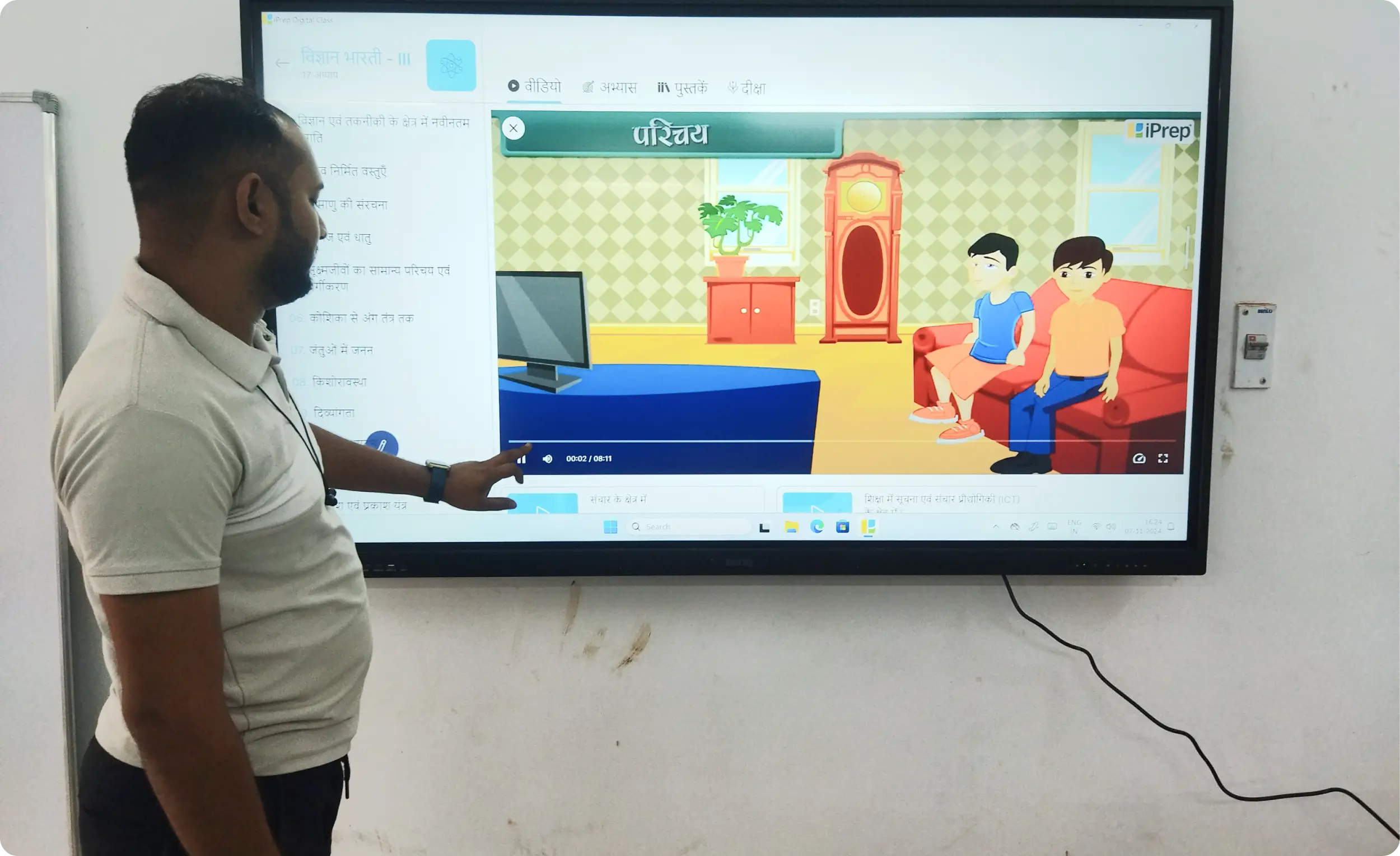 Digital learning content displayed on an interactive touchscreen panel in a classroom