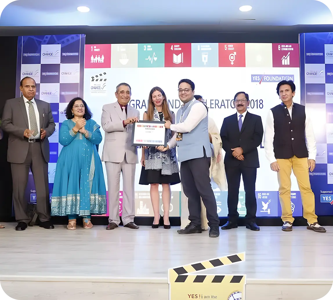 Rohit Prakash receiving an award on behalf of iDream Education, presented by Yes Bank Foundation under the YES! i am the CHANGE initiative