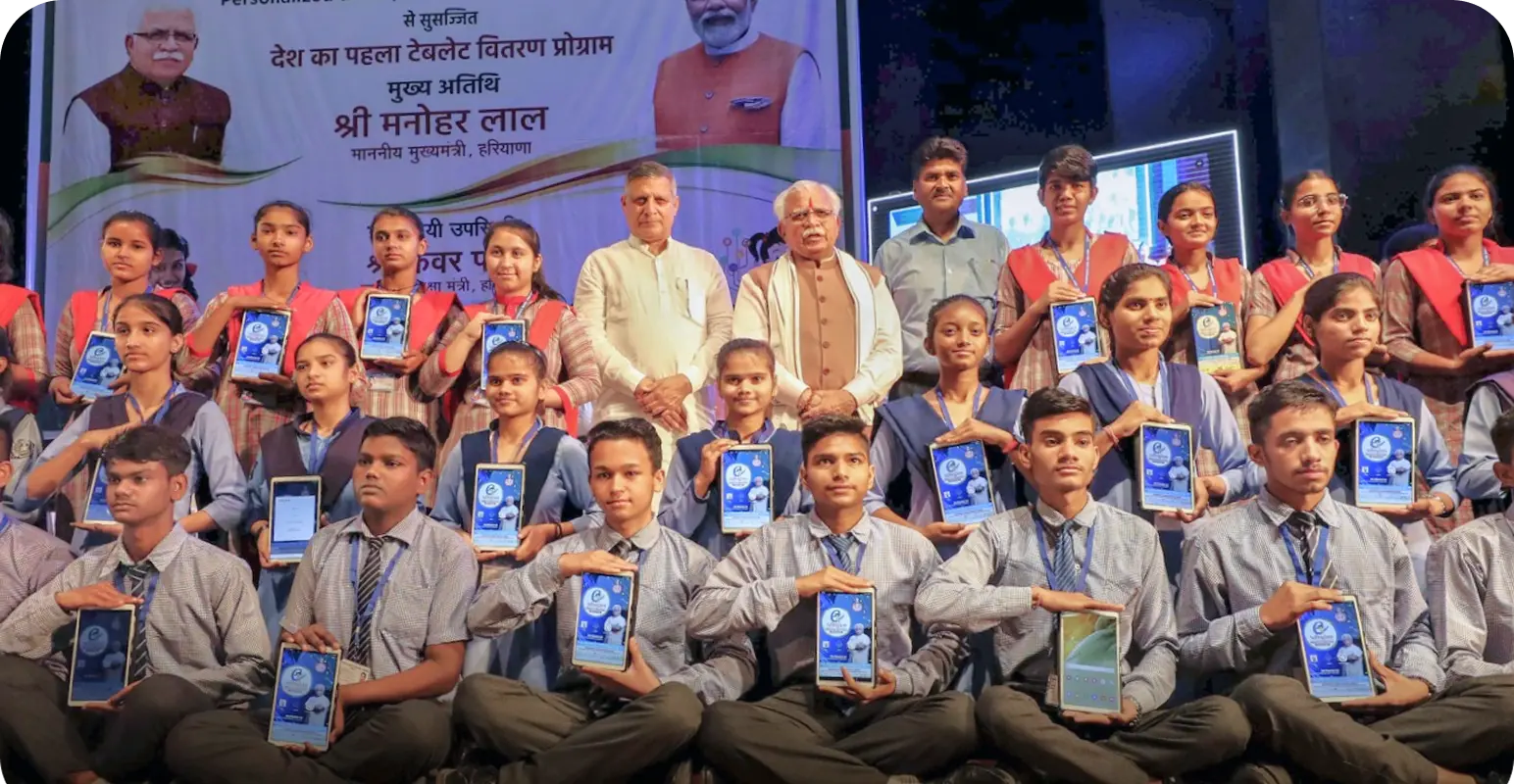 Chief Minister of Haryana inaugurating the e-Adhigam initiative alongside students holding Samsung tablets preloaded with personalized adaptive learning software
