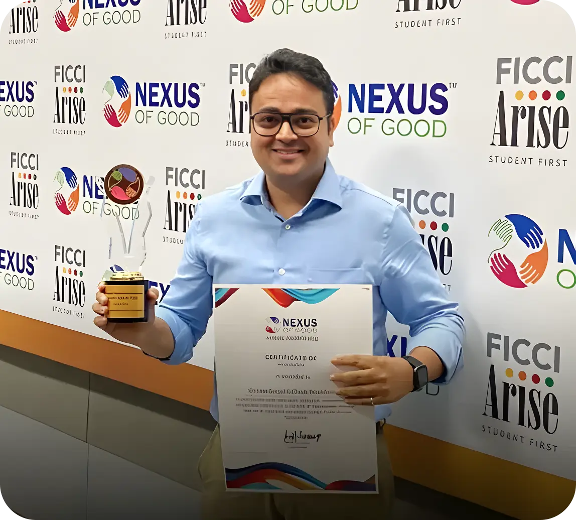 Rohit Prakash showcasing the Nexus of Good recognition and award to iDream Education for its iPrep initiative, ensuring last-mile learning access during COVID-19