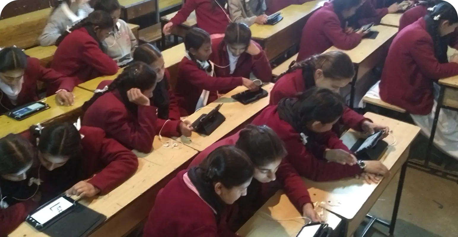 Students engaged in personalized learning using education tablets preloaded with NEP-aligned digital content