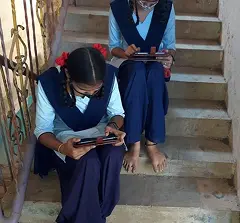 Students learning through CBSE content on the best learning tablet provided by iDream Education