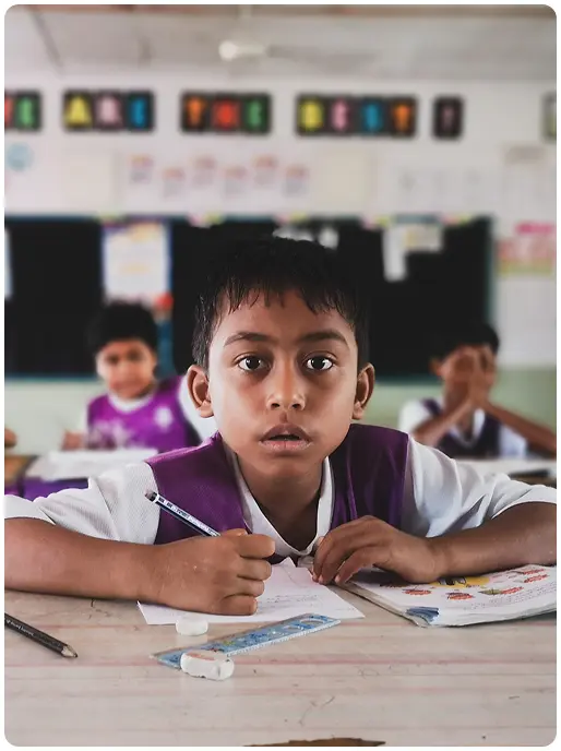 Student from government school of India excited about digital learning solutions provided by an EdTech NGO