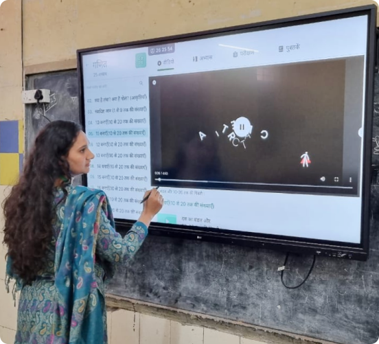 Teacher conducting lesson in smart classrooms which is one of the part of the digital education projects under the ICT scheme of Samagra Shiksha Abhiyan, using interactive technology to enhance student learning