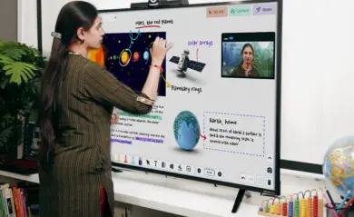Teacher using a smart interactive board for teaching
