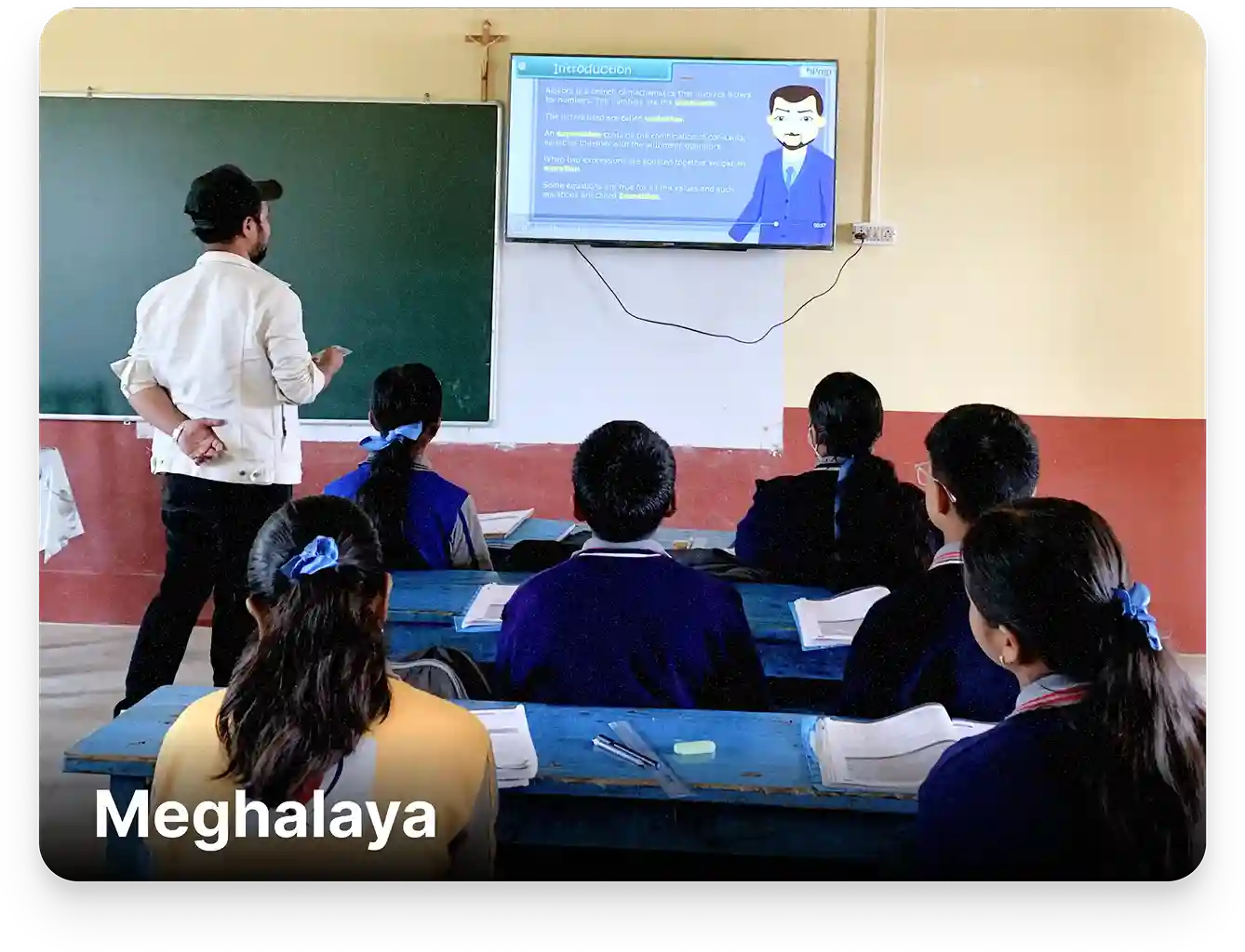 Image showing smart class setup in a Meghalaya with a teacher delivering lessons using smart class content aligned to the Meghalaya Board curriculum