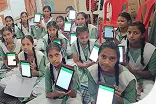 Image showing students holding learning tablets — one of the best digital learning solutions