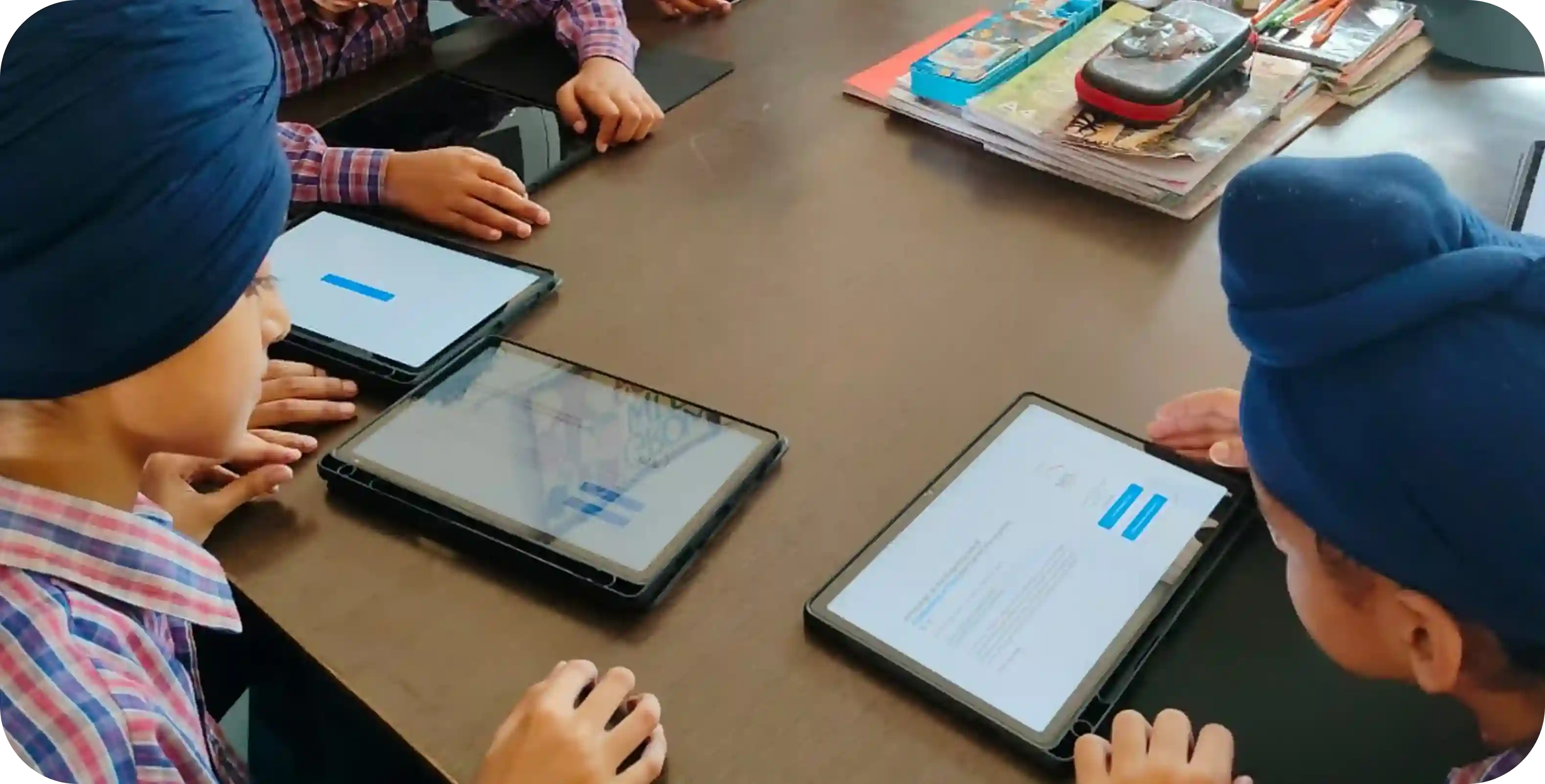 Students using PAL software on learning tablets in a PAL Lab setup within a school