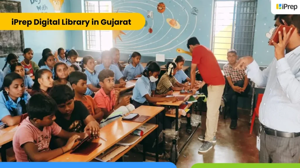 setup of ICT lab | ICT lab in Gujarat | iPrep digital library tablets Image showing students using tablets under teacher guidance in an ICT lab setup at a school in Gujarat.