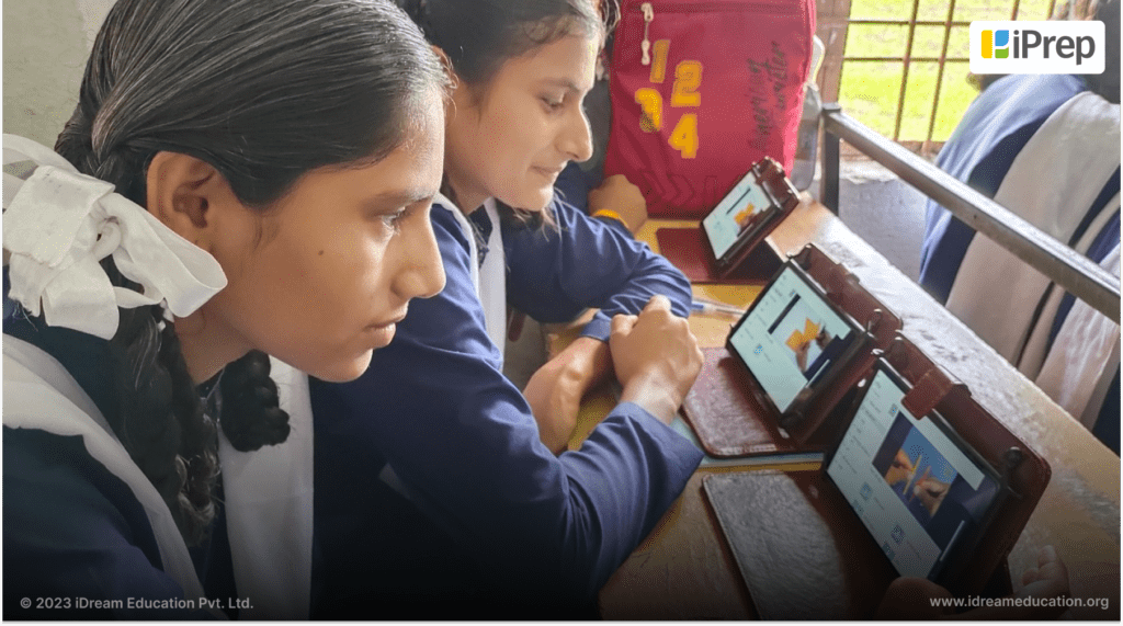 Students engaged in project-based learning with iPrep technology.