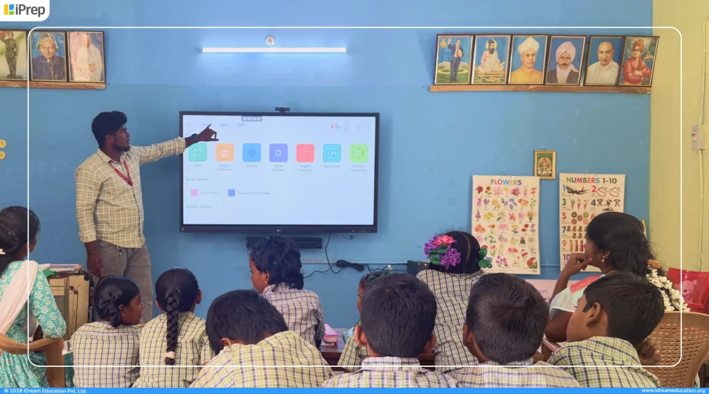 Teacher using Tamil Board-aligned digital content on IFP-based smart class in a Tamil medium