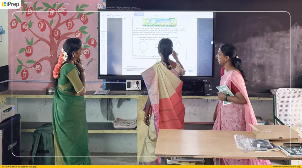 Teachers interacting with Tamil Board–aligned smart class content in a school