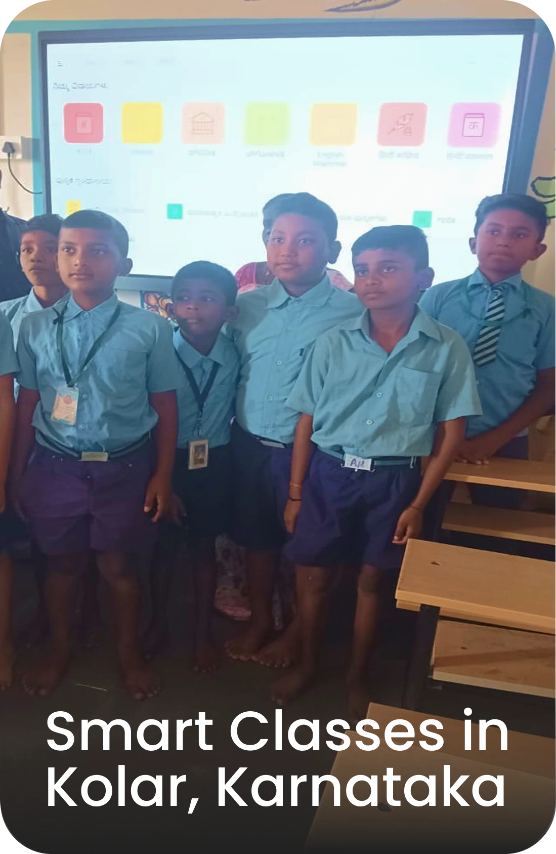 Group of students showcasing interactive flat panel-based smart class in Kolar, Karnataka government school