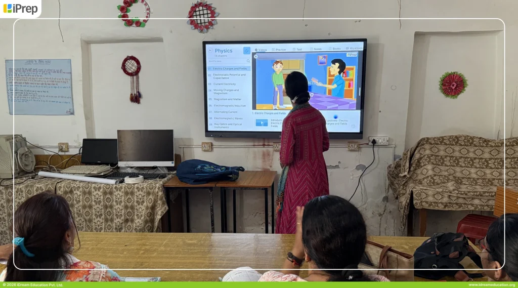 School teacher using animated video content on smart class setup in Uttarakhand
