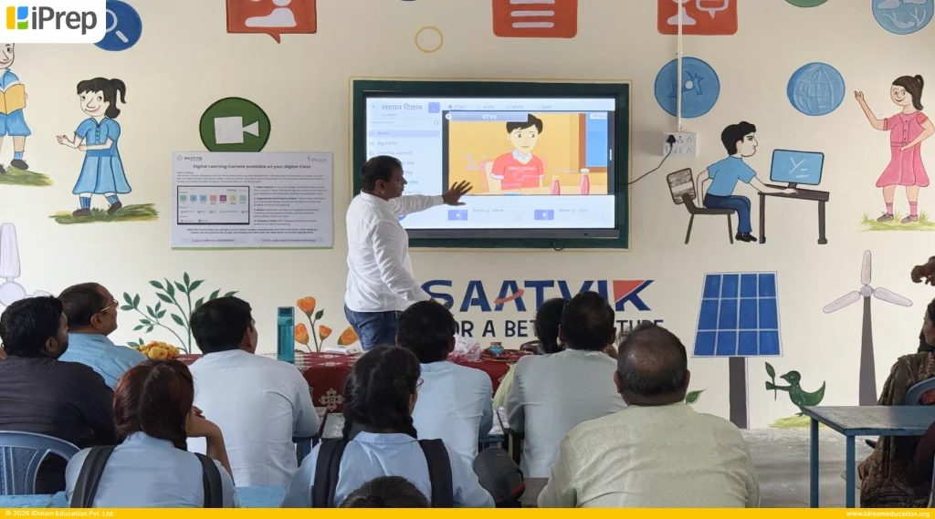 Teacher exploring animated video content on smart class in Itawa Bhopji School of Jaipur