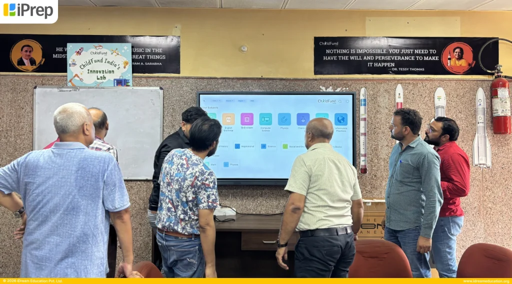 Teachers exploring smart class content on an IFP-based smart class in New Delhi school