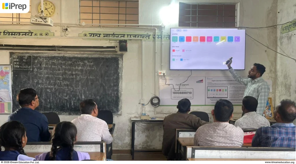 iDream Education team member conducting smart class training on using smart classroom LMS and smart class content in a Raigarh school, Chhattisgarh
