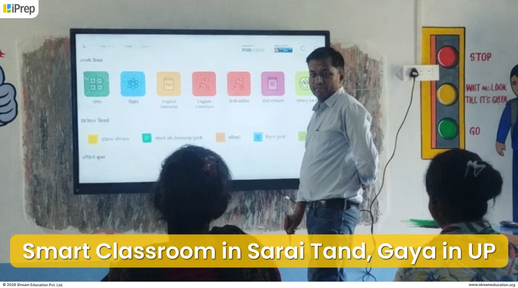 Teacher navigating iPrep smart class LMS on interactive flat panel during Smart Class session in Sarai Tand, Bihar
