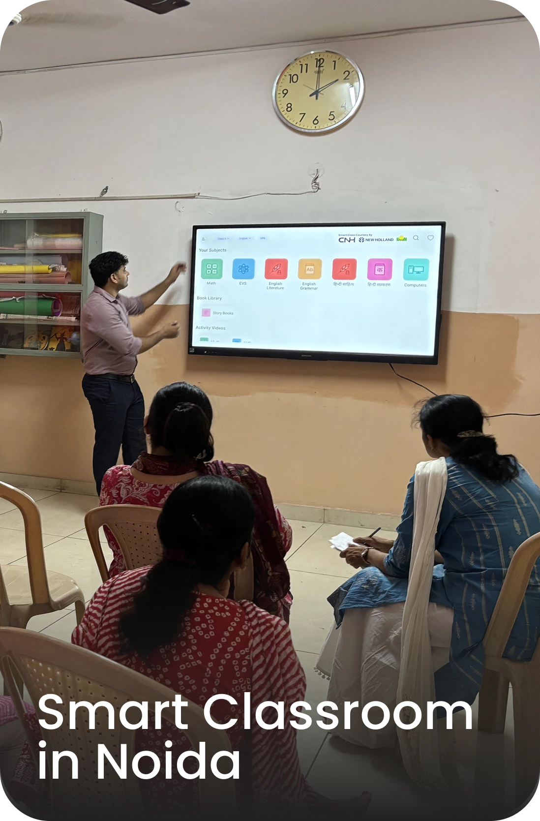 iDream Education team member conducting smart class training in Noida school