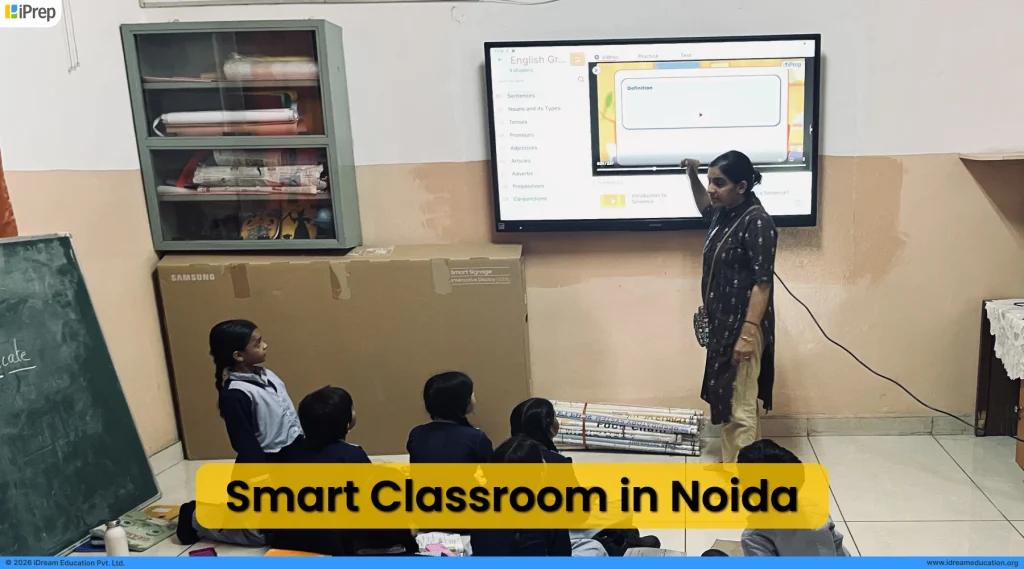 Teacher teaching in classroom through smart class digital content on an IFP panel in Noida school