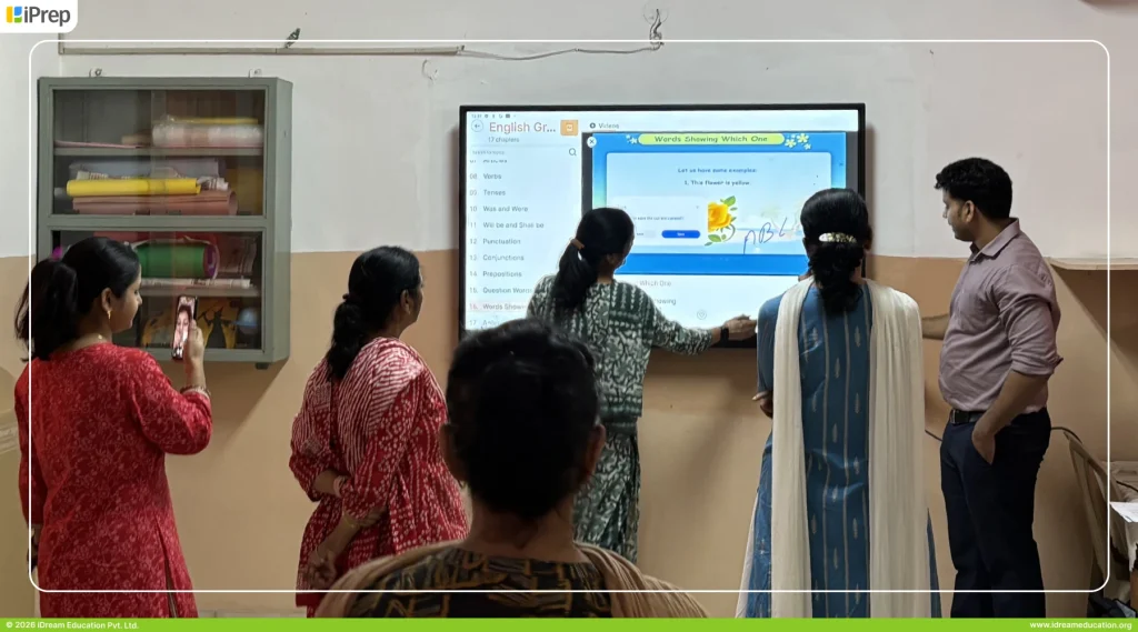 Teachers exploring smart class content on an IFP-based smart class in Noida school