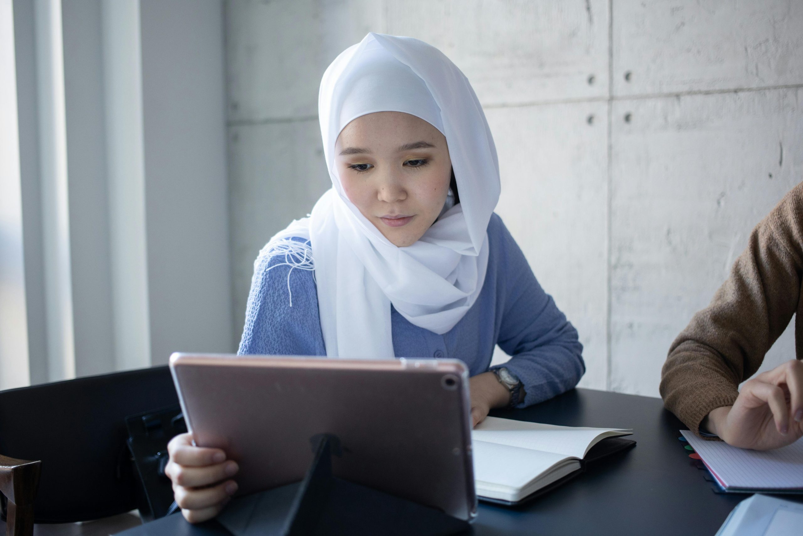 Student using iPrep PAL adaptive learning on a tablet A student in the Arab world engaged in focused individual learning on a tablet, reflecting the need for personalised education in MENA government schools