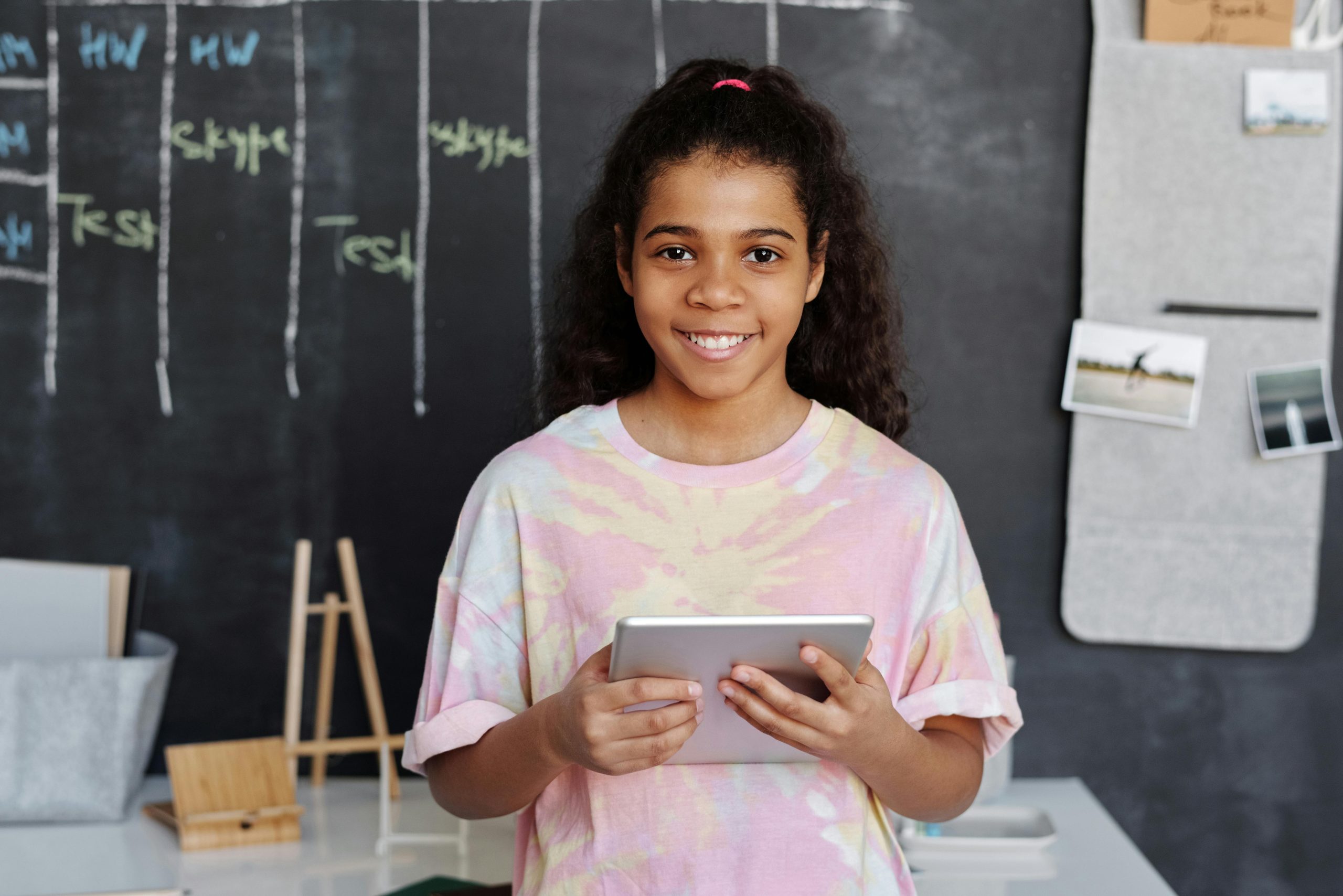 Students using offline learning tablets in a remote African school Children in a rural Sub-Saharan African school using preloaded tablets for offline curriculum-aligned digital learning