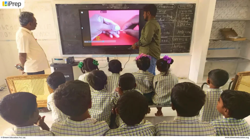 Students actively engaged with smart class content in a government school classroom