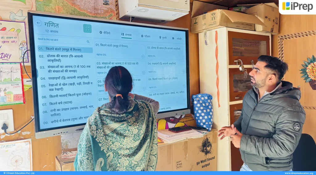 Teacher using smart class at a learning centre in Gurugram to teach through interactive digital learning resources