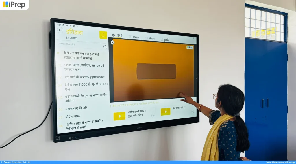 Teachers exploring smart classroom resources in their digitally enabled government school.