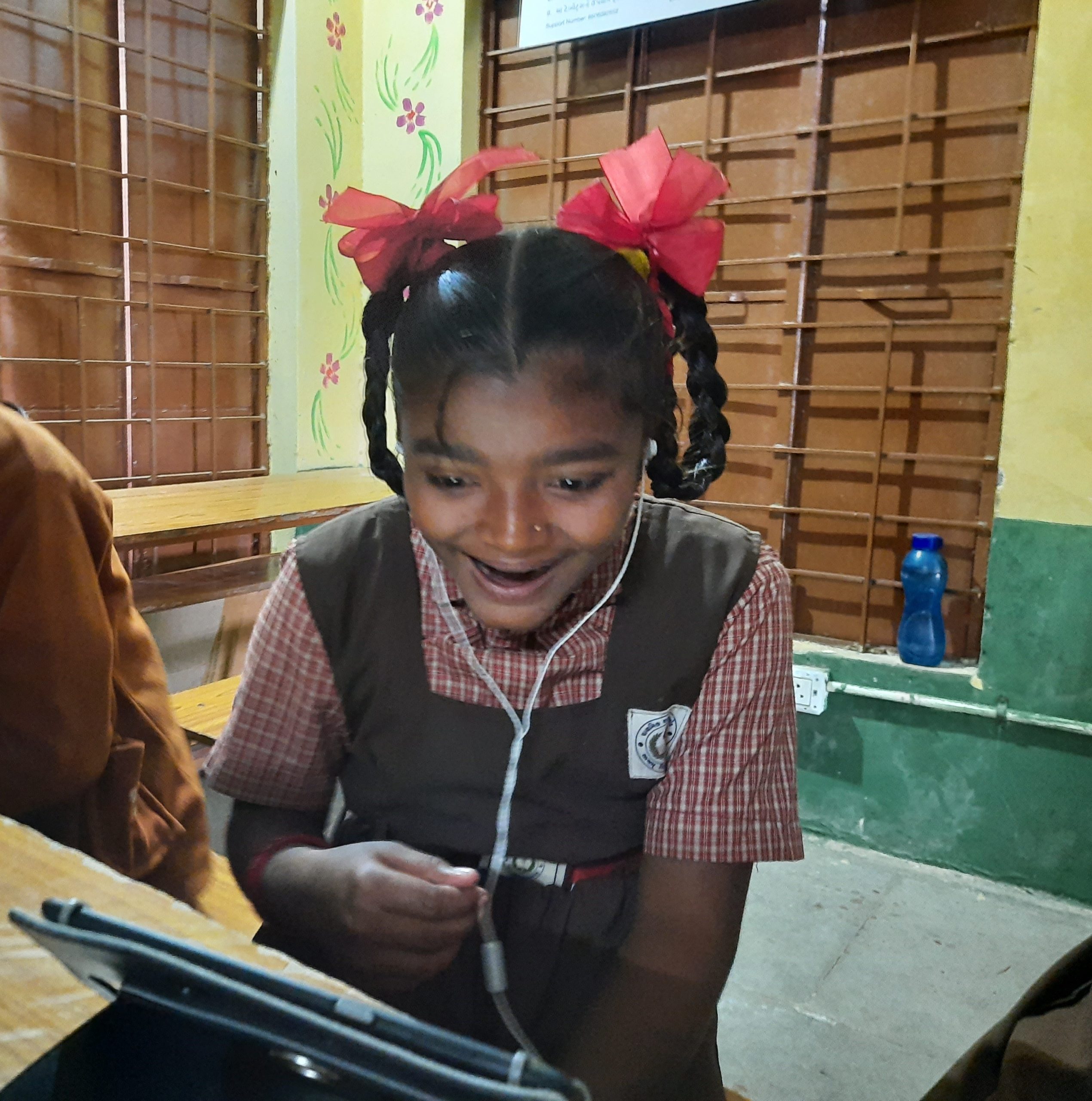 Girl student joyfully learning with iPrep tablet